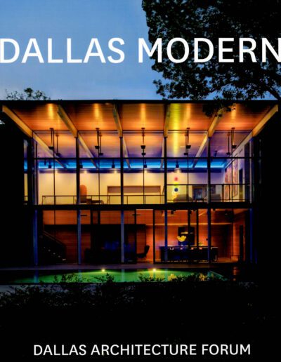Modern glass-fronted architecture illuminated at dusk with the text "dallas modern - dallas architecture forum.