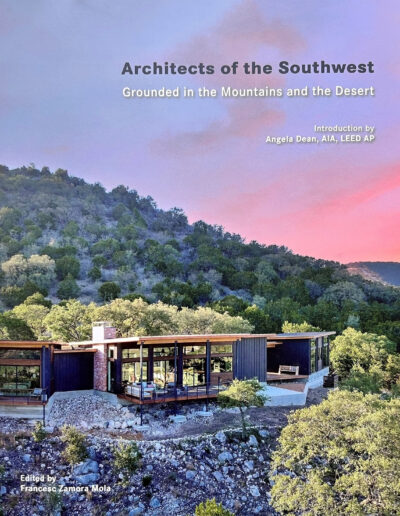 A modern southwest-style house nestled among forested hills at dusk, featured on the cover of a book titled "architects of the southwest - grounded in the mountains and the desert.